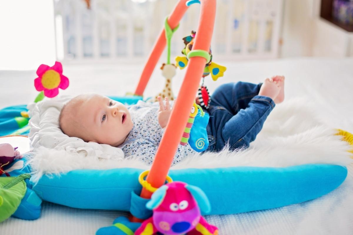 Baby in portable baby gym