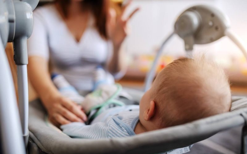 baby-laying-in-graco-swing